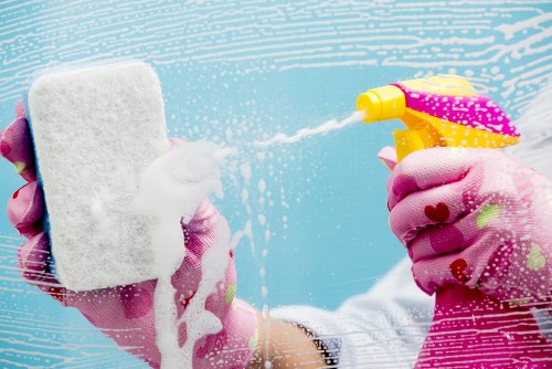 Technician performing detailed sofa cleaning steps